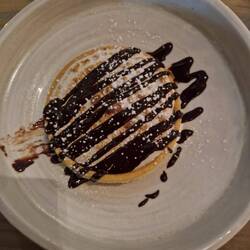 Delicious dessert at Boardwalk..lemon meringue with chocolate sauce