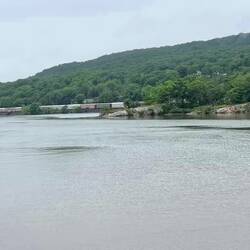CSX auto rack unit train, northbound on the western side. Auto racks are tri-level car carriers.