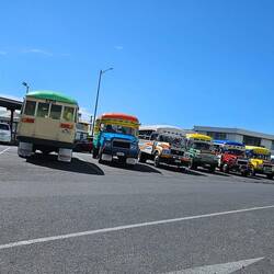 The local buses are brightly painted and decorated.
