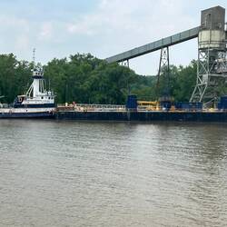 A typical barge-pushing tugboat. The elevated wheelhouse is for the captain to see ahead of the load