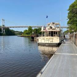 On the wall in Rondout Creek, and ready to go. Shore power still connected.