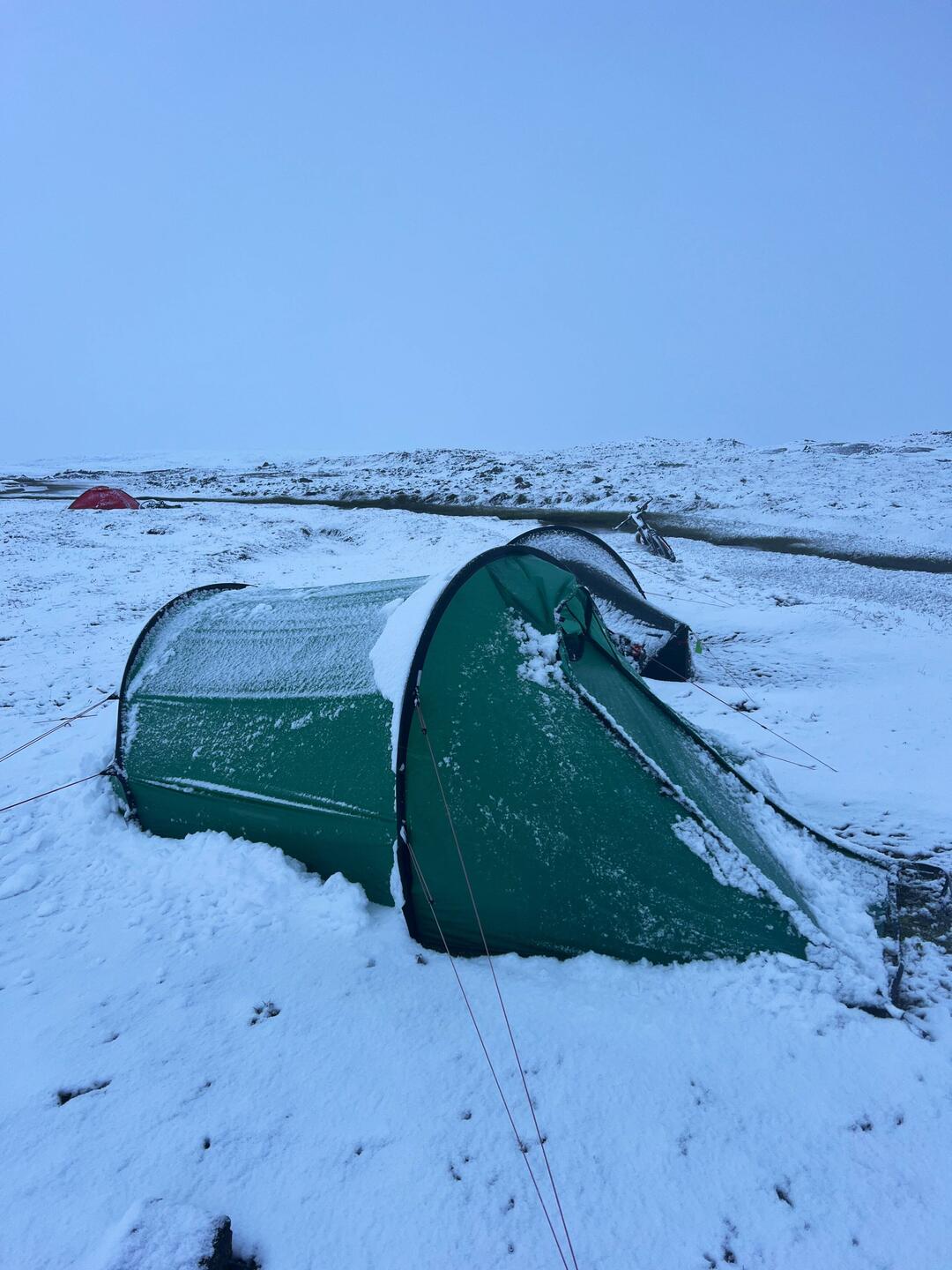 Just after midnight and after I shake the snow from the tent