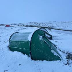 Just after midnight and after I shake the snow from the tent