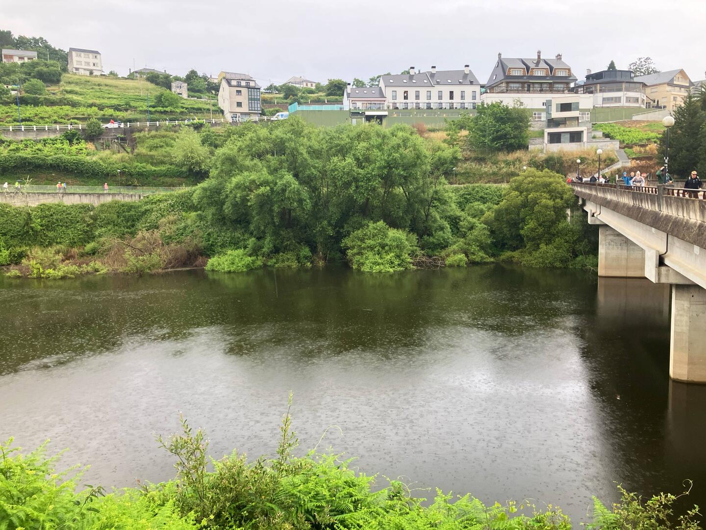 Pilgrim March over the bridge in the rain saying adios to PORTOMARÍN