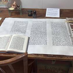 Scribe mid-restoration of Torah