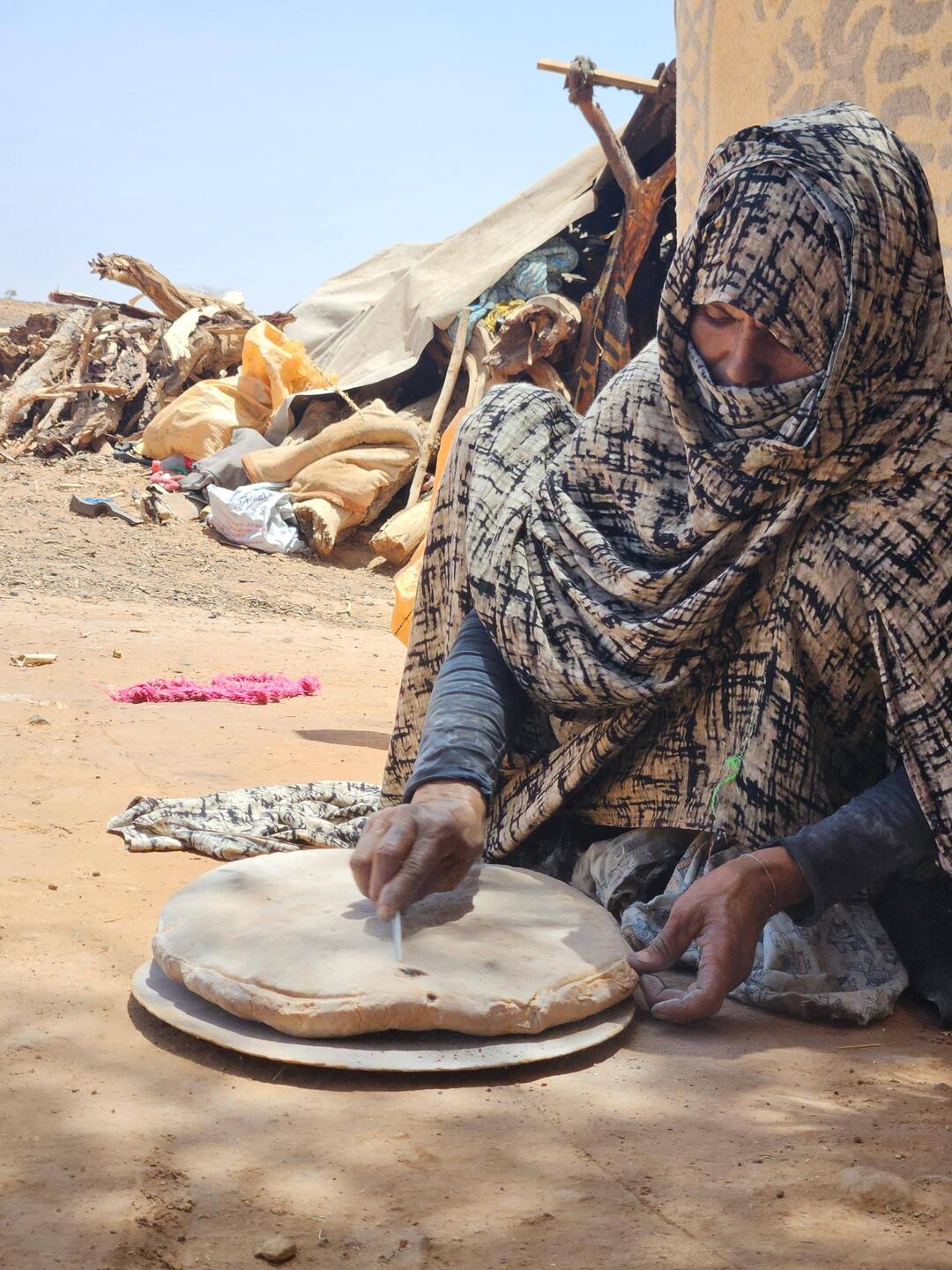 Hira preparing taguella, delicious sand bread