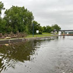 Departing Lock 12 after an overnight on the wall. A barge-load of flotsam has been collected