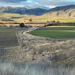 The dirt road taking us away from the highway went over hills with sweeping valley views.