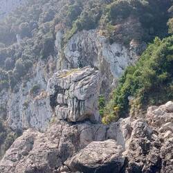 Look closely and you will see a statue on top of the rock, called Gennarino Scugnizzo