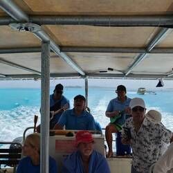 The crew serenades us on our way to the snorkel spot.