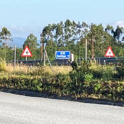 Airport signs in the highway 12 miles to the city