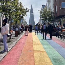 Rainbow street with Reykjavík church behind