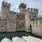 Sirmione Castle looks pretty awesome surrounded by lake water as it's moat
