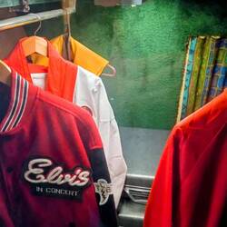 Jackets hanging in the plane. There was also a barber salon on board. He would always look his best.