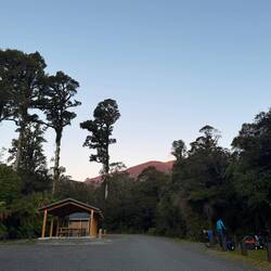 Paringa. DoC campsites are great. Free/cheap and often have toilets and sheltered picnic benches