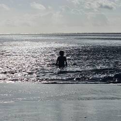 Thomas emerging from the ocean.