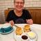 Janet getting ready to enjoy scones with clotted cream and jam