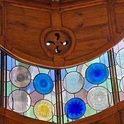 Notice the vent and stained glass