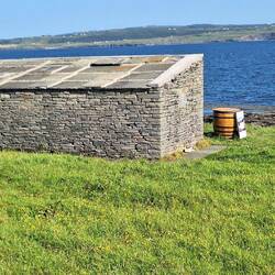 A whiskey barrell filled with hot water and seaweed- Wild Atlantic Seaweed Bath