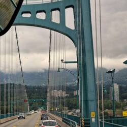 A bridge over the harbour going to the Capulino suspension bridge gardens