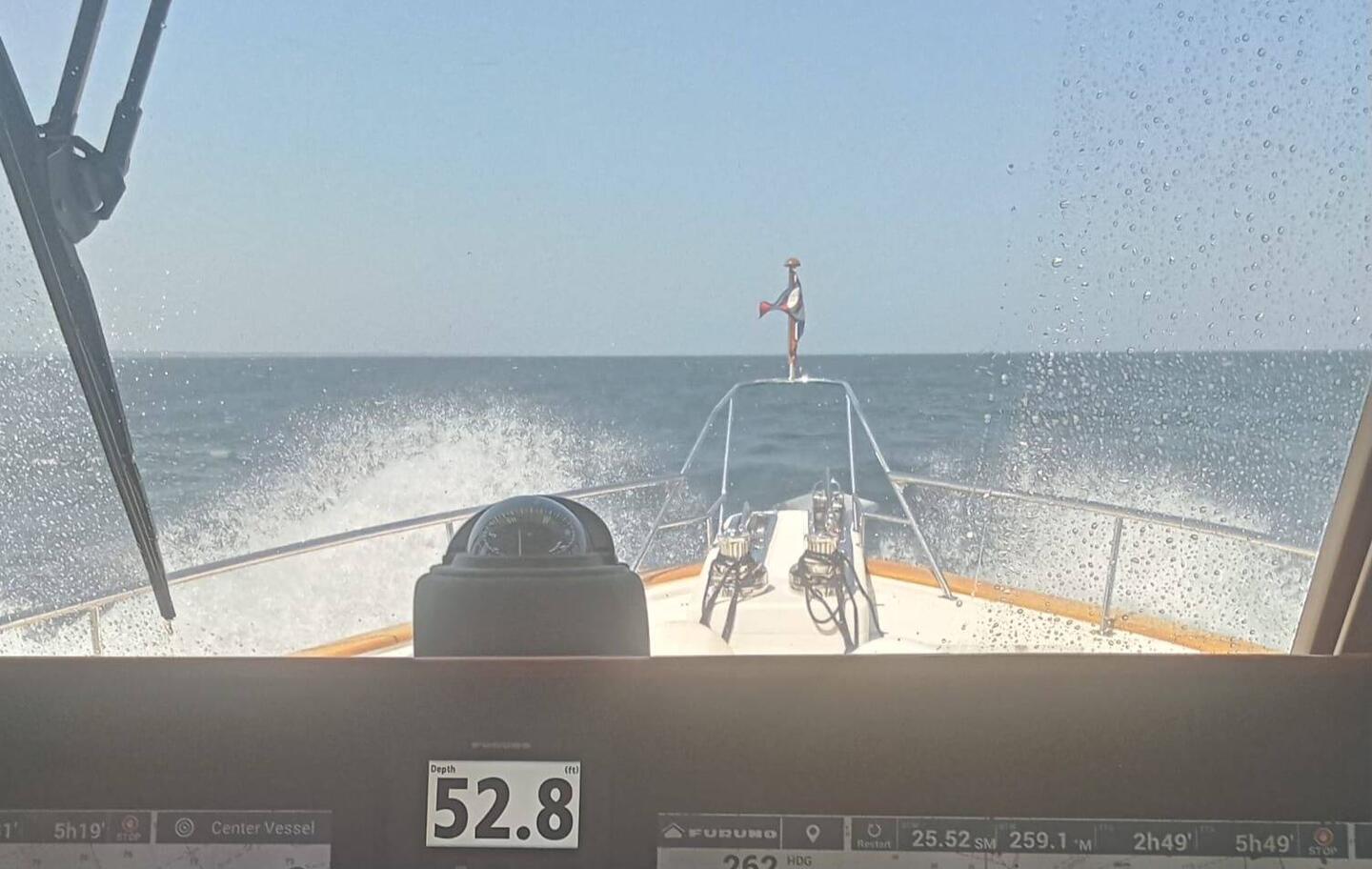 Graeme snaps a 3-ft swell over the bow as we cut through at 9 mph