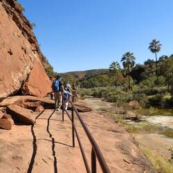 At least there is a handrail here (but we climb to the top of the rock on our left)