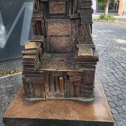 A chair constructed of books and then bronzed outside the Gutenburg Museum.