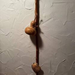 Staff, water gourd, and scallop shell symbolic of pilgrims.