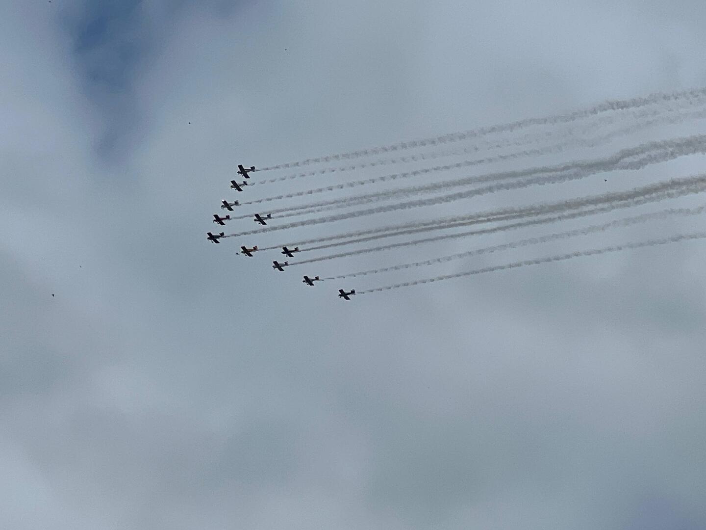 Small formation of airplanes flying near Chippewa Falls.