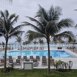 View of the pool and beach from my dinner table.