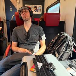 Chris on the train... working on some shuteye!