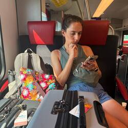 Chelsea on the train, always working!