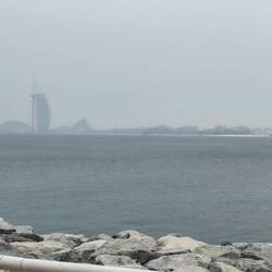 View through the haze of the Burj Al Arab Hotel, from the end of the palm breakwater