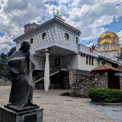 Mother Theresa's Memorial (looks like a spoon with chocolate on it is holding the house)