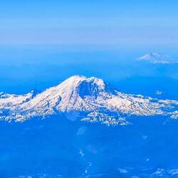 Mount St. Helens and a distant Mount Rainier (?)