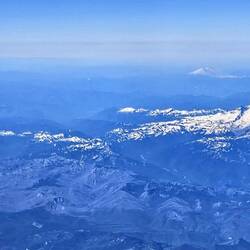 Five snow-capped mountains as we approach Vancouver