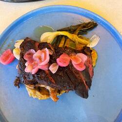 Beef with salsa verde and pickled onions