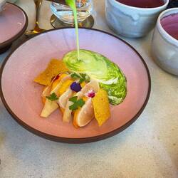 Fish with mango slices and coconut sauce