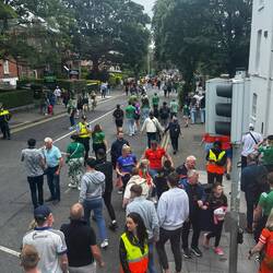From the bus we see the crowds in the distance assembling for the big football match