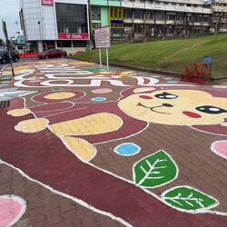 Painted sidewalk in front of Prang Sam Yot.