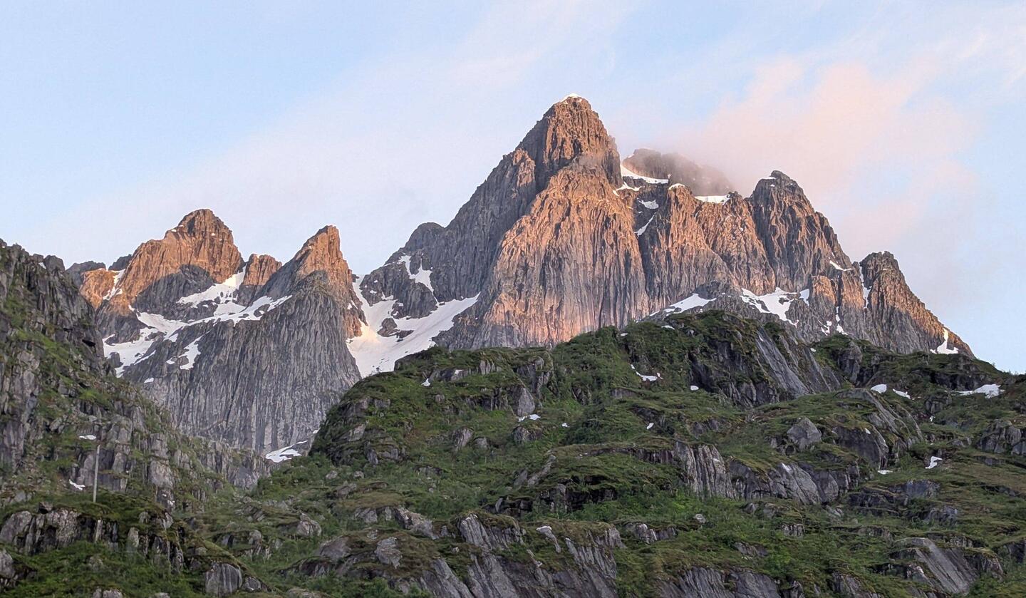 Taken at midnight as proof the sun is up, just behind the mountains