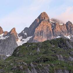 Taken at midnight as proof the sun is up, just behind the mountains