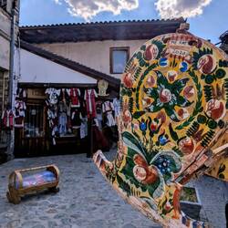Traditional Kosovo/Albanian clothing and wood cradle. "Me fat" means "Good luck" in Albanian