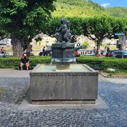A sculpture depicting squeezing a goat in a wine press to see if it gave wine.