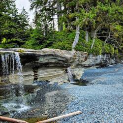 Small waterfall running onto Sandcut Beach
