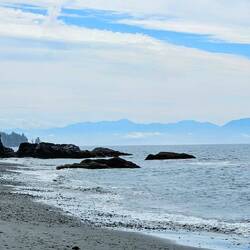 Olympic mountain range in Washington state across the strait from Sandcut Beach in Jordan River Park