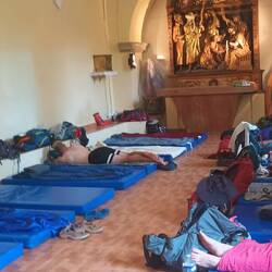 M friend Cat sent me a picture of the sleeping room at the albergue at the church here.