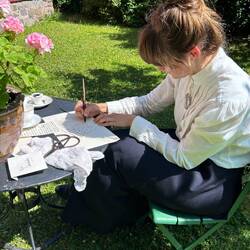 Writing letter with a quill pen