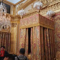 The Queen's bed chamber.  Our guide, Wei, is describing the room.