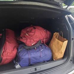 Packs loaded in the Peugeot.